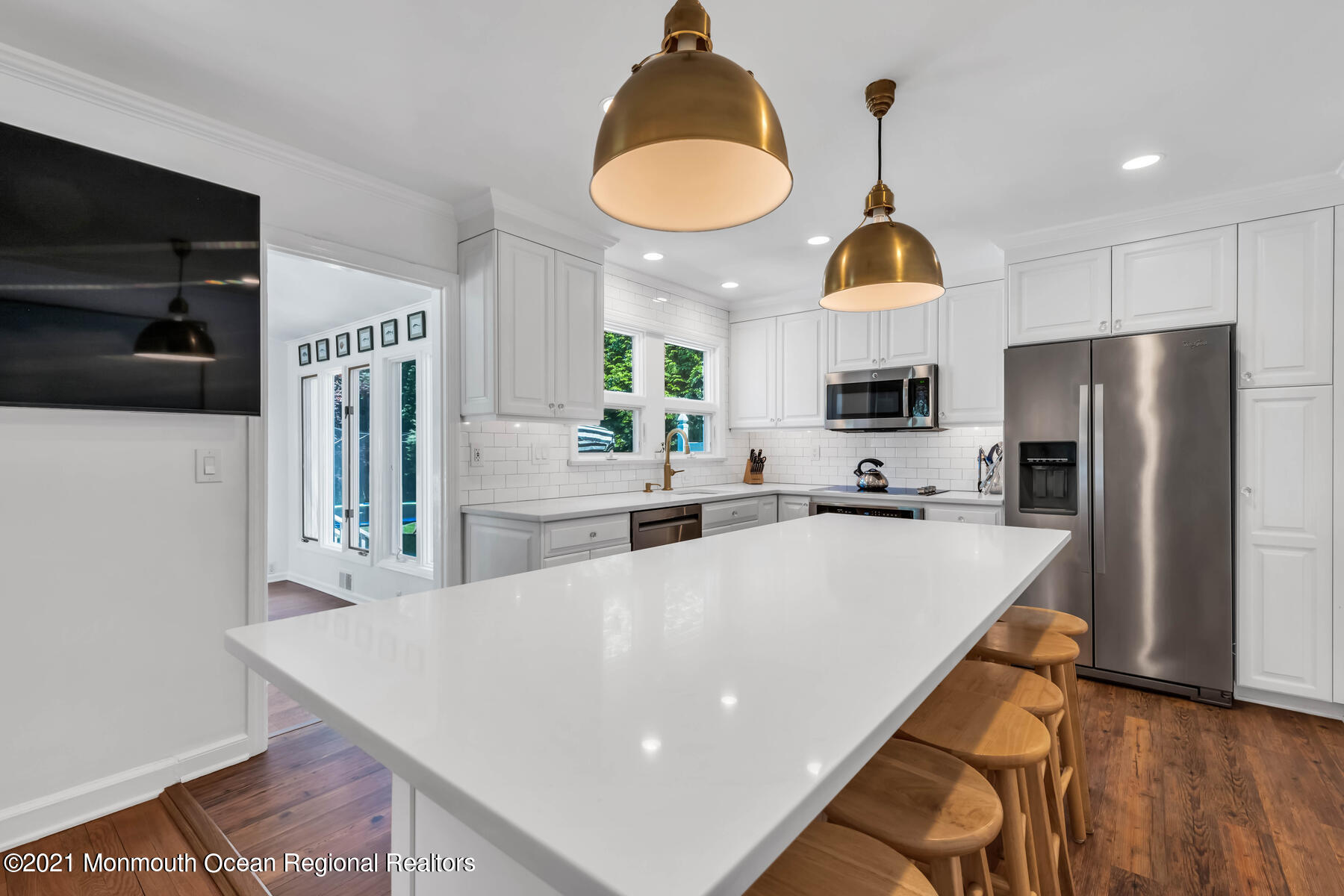 200 Lorraine Avenue Spring Lake, NJ 07762 - Photo 29 of 36 a kitchen with stainless steel appliances a stove a refrigerator a oven a sink a oven and a dining table