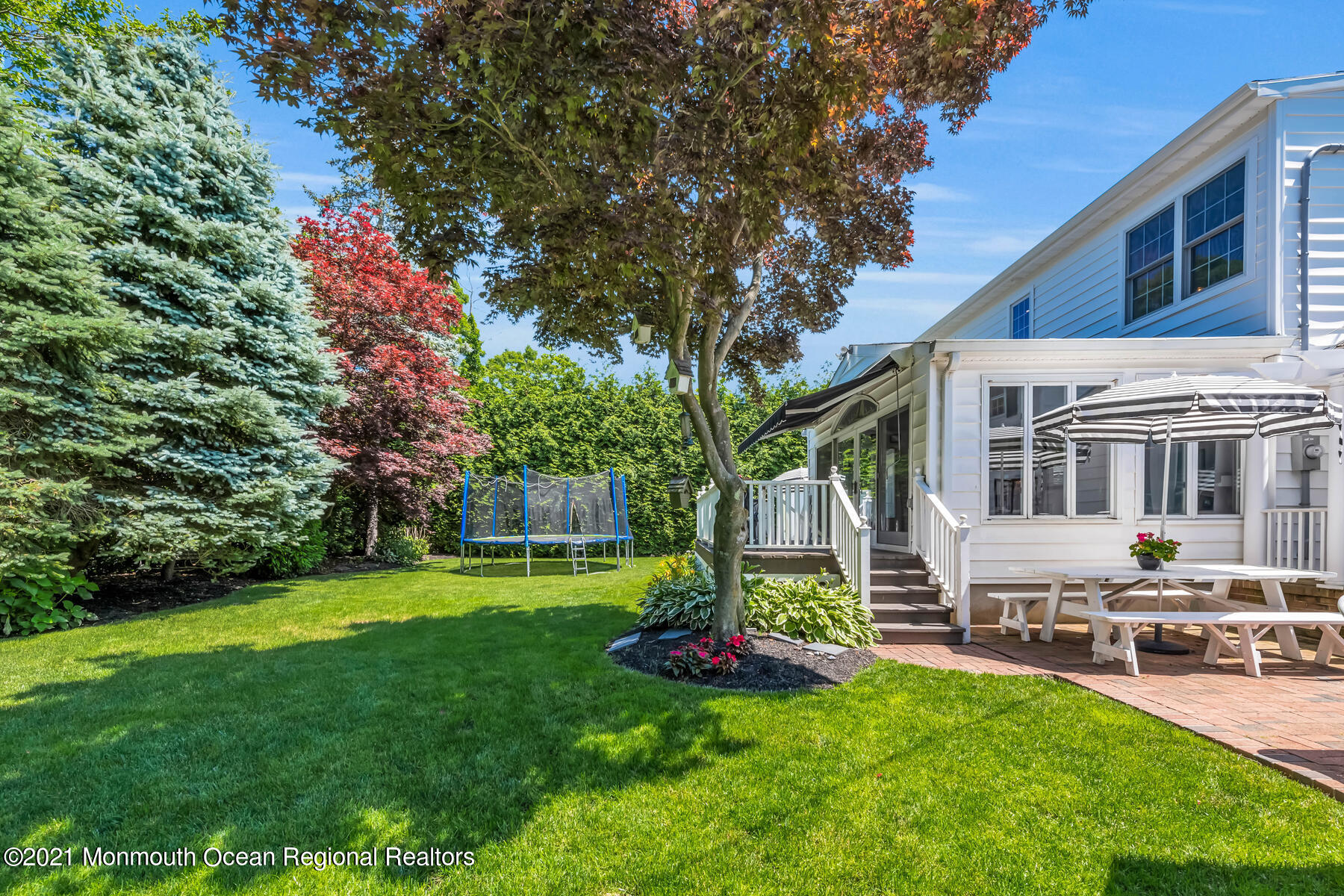 200 Lorraine Avenue Spring Lake, NJ 07762 - Photo 29 of 36 a view of a house with a yard porch and sitting area