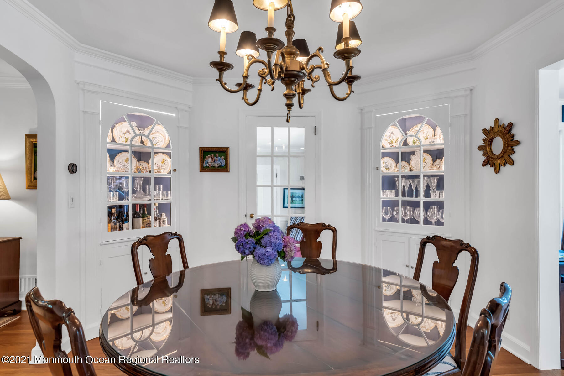 200 Lorraine Avenue Spring Lake, NJ 07762 - Photo 10 of 36 a view of a dining room with furniture a chandelier and wooden floor