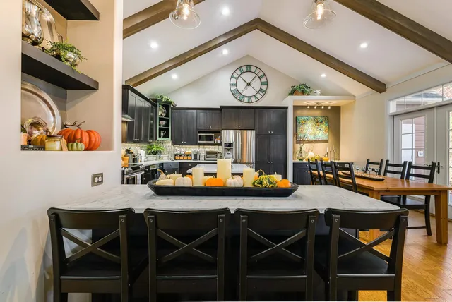 a view of a dining room with furniture and a window