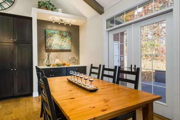 a view of a dining room with furniture and a window