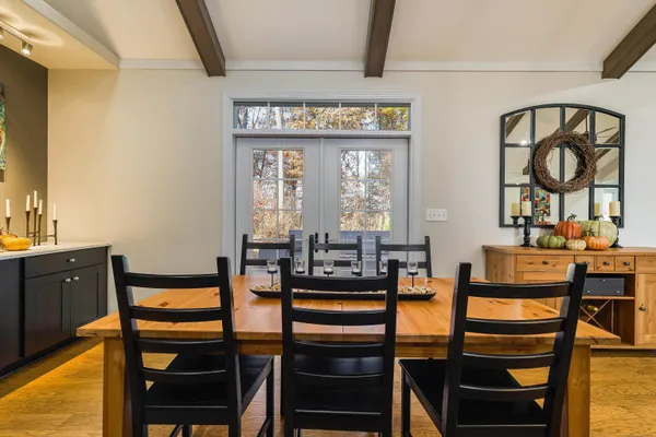 a view of a dining room with furniture and window