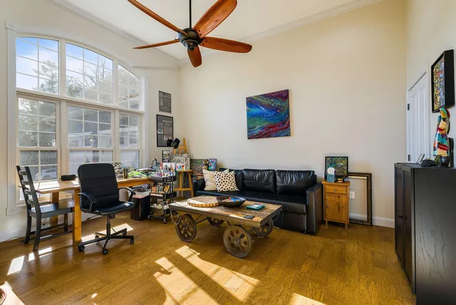 a bathroom with a tub a sink and glass door