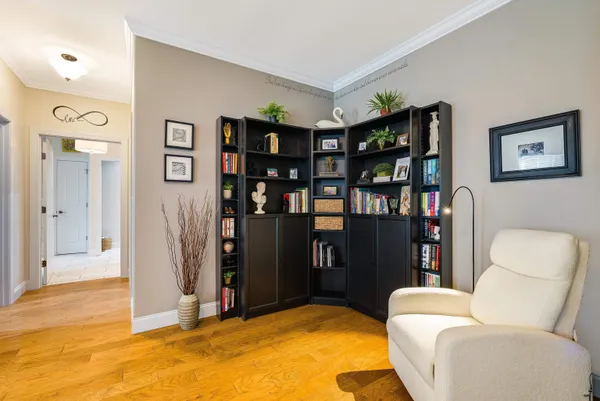 a living room with furniture a walk in closet and a window