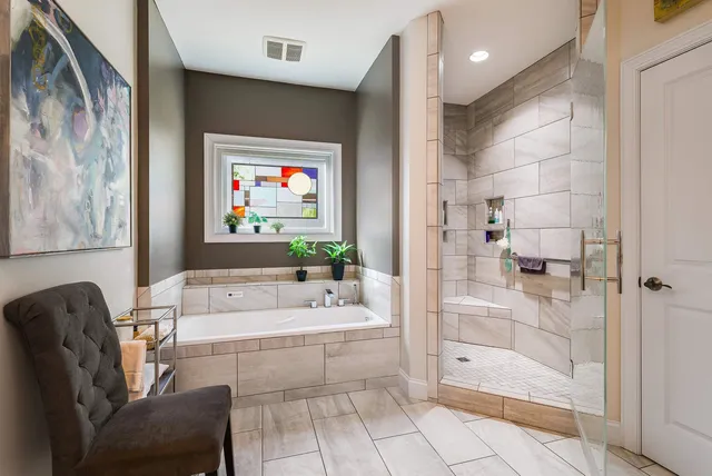 an aerial view of a house with a yard and mountain view