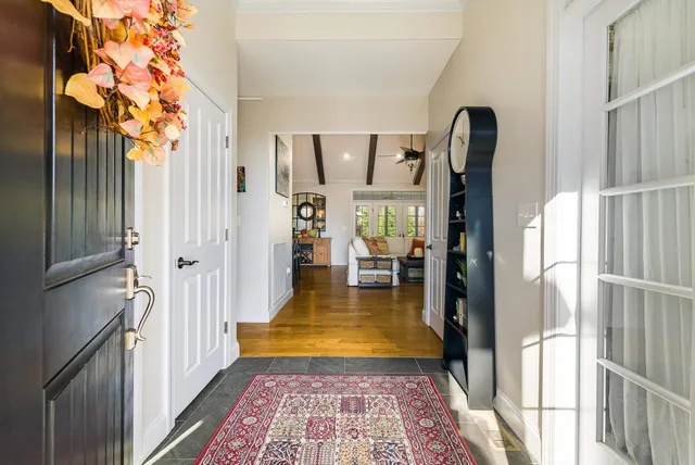 a living room with a fireplace and a flat screen tv