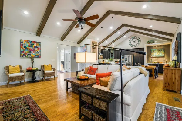 a living room with furniture and a clock