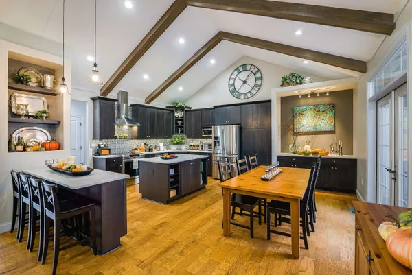 a kitchen with a table and chairs in it