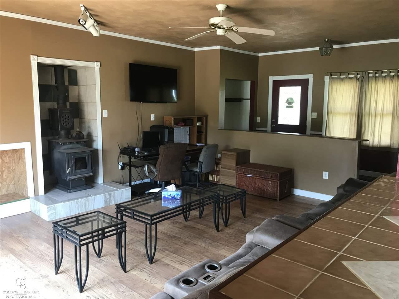 1488 East Wellman Line Road Yale, MI 48097 - Photo 11 of 35 This is a view of the entry and living room from the kitchen.