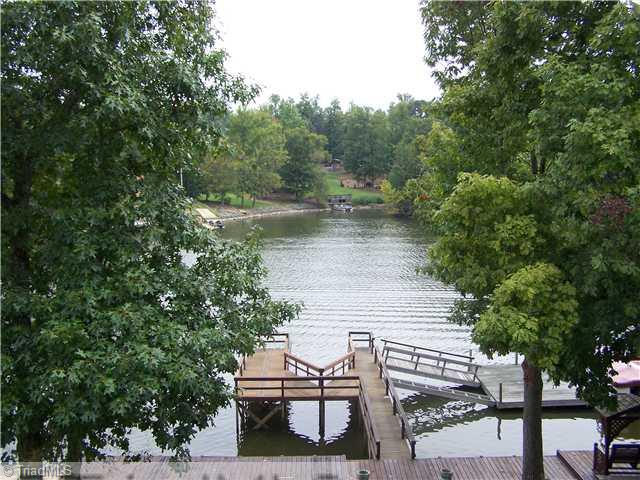 1661 Warf Road Lexington, NC 27292 - Photo 14 of 16 Waterfront/Dock/Pier. A viewfrom the yard showing the boardwalk and pier.