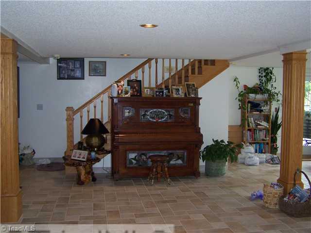 1661 Warf Road Lexington, NC 27292 - Photo 6 of 16 Game. A view of the lower level. All tile floors. Beautifully fininished. One large room.