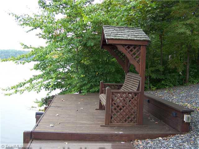 1661 Warf Road Lexington, NC 27292 - Photo 9 of 16 Patio/Deck. waterside patio, boardwalk across the front. Great sitting area to watch the boats and pontoons go by and wave at your friends. Very relaxing
