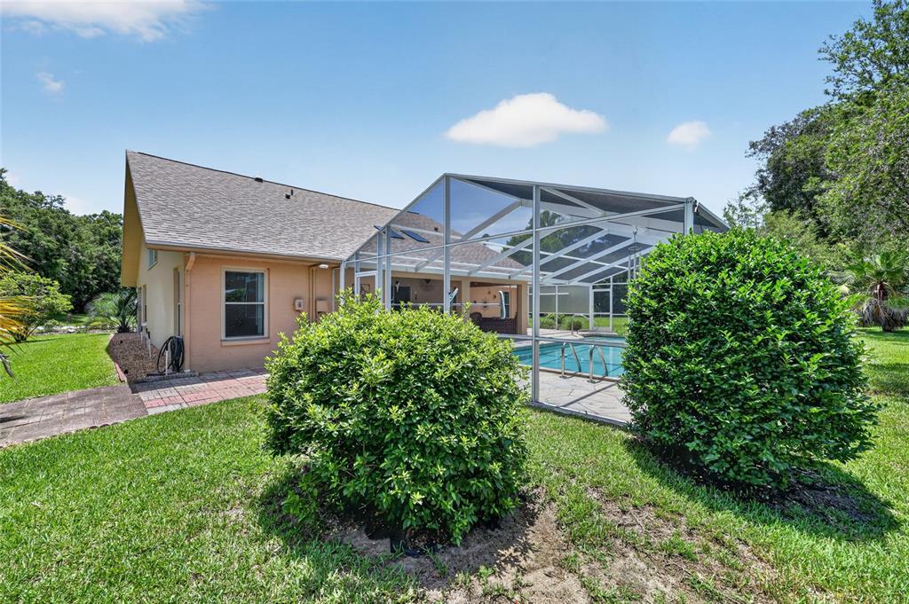 19025 Southwest 98th Loop Dunnellon, FL 34432 - Photo 56 of 80 a front view of a house with a yard and porch