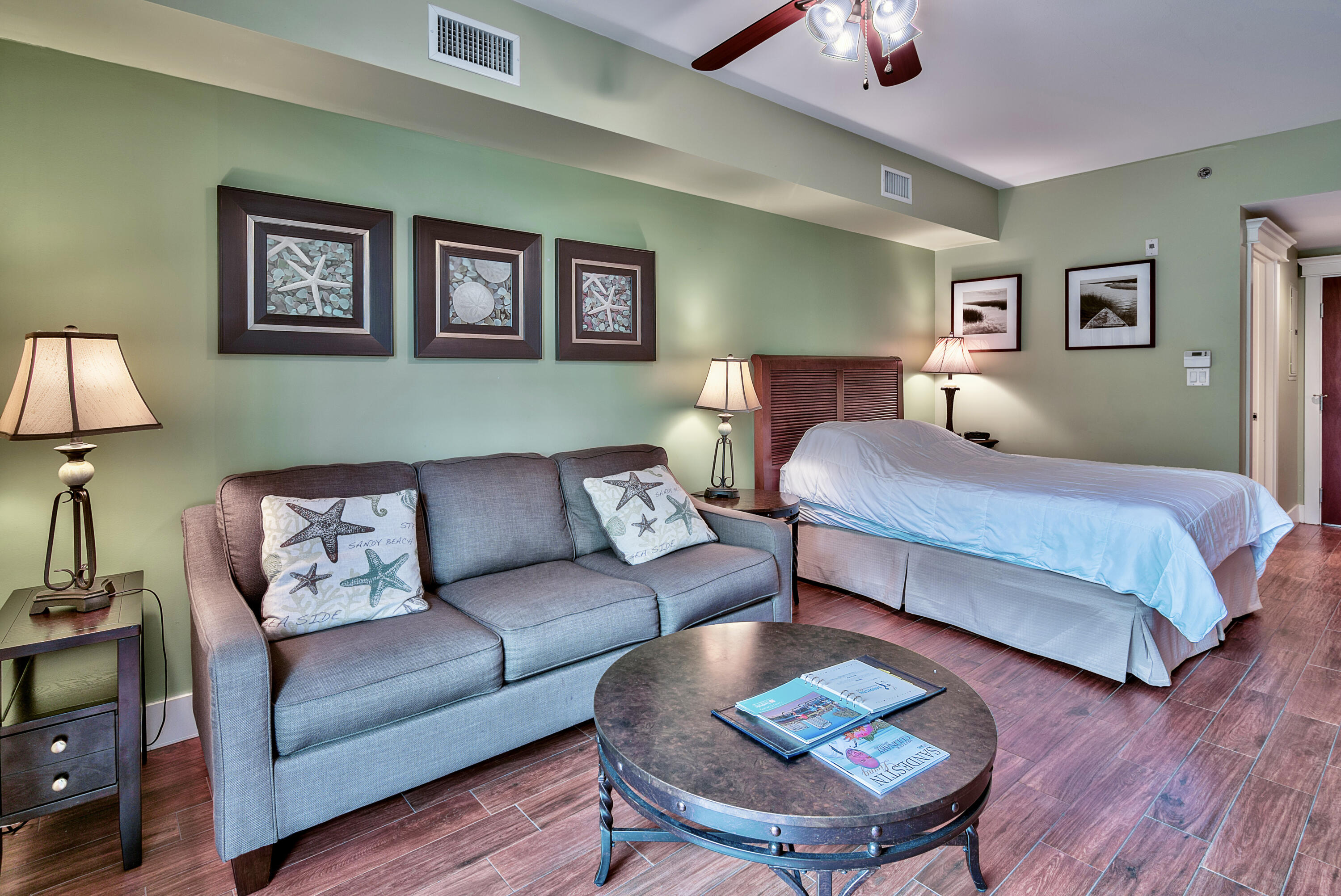 a living room with furniture and a lamp