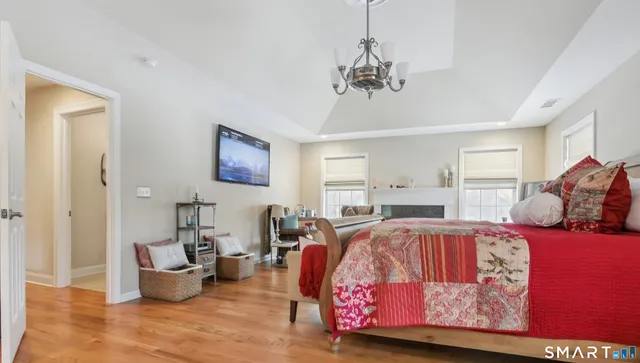 a bathroom with a granite countertop sink a mirror and a shower