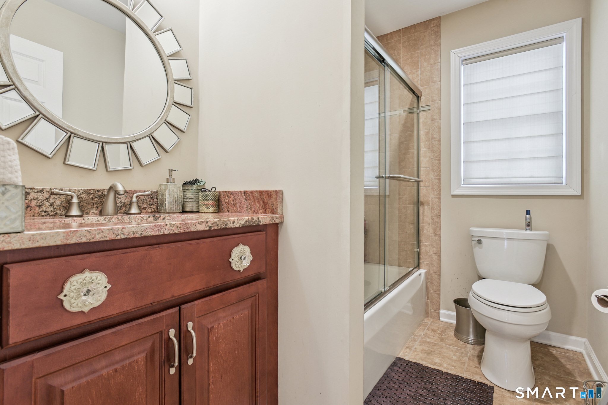 10 Ball Road North Haven, CT 06473 - Photo 26 of 35 a bathroom with a toilet a sink and a mirror