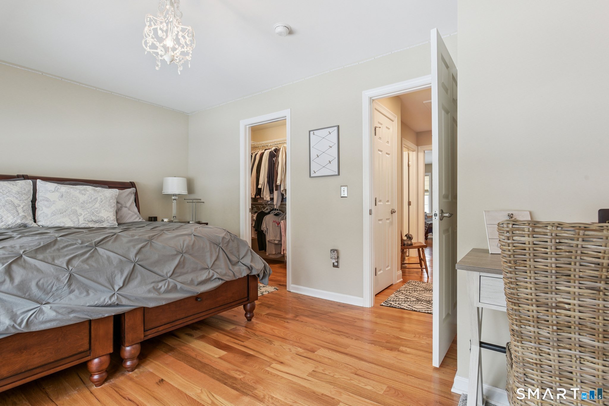 10 Ball Road North Haven, CT 06473 - Photo 28 of 35 a bedroom with a bed and wooden floor