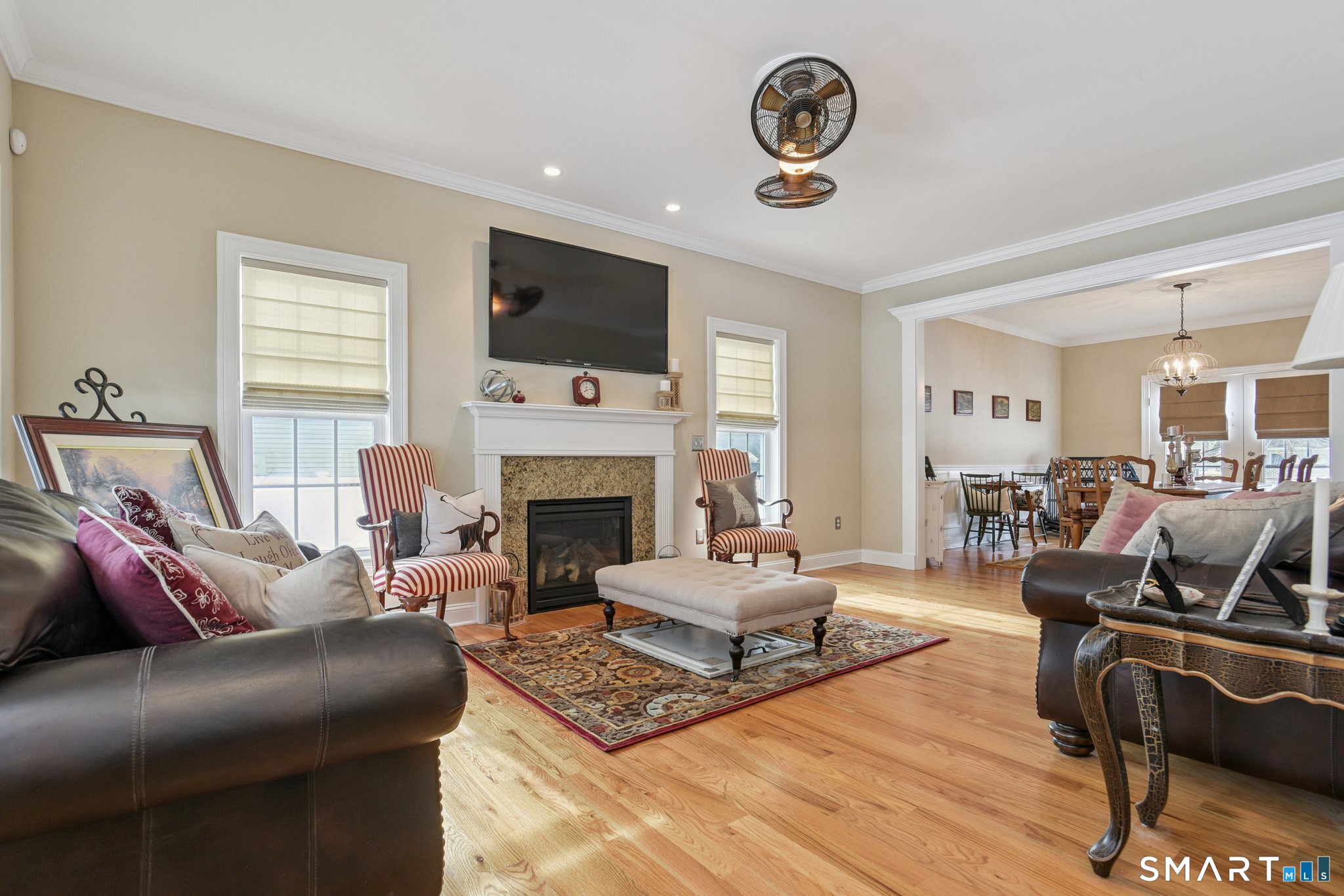 10 Ball Road North Haven, CT 06473 - Photo 3 of 35 a living room with furniture a fireplace and a flat screen tv