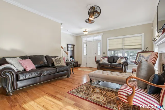 a living room with furniture and a rug