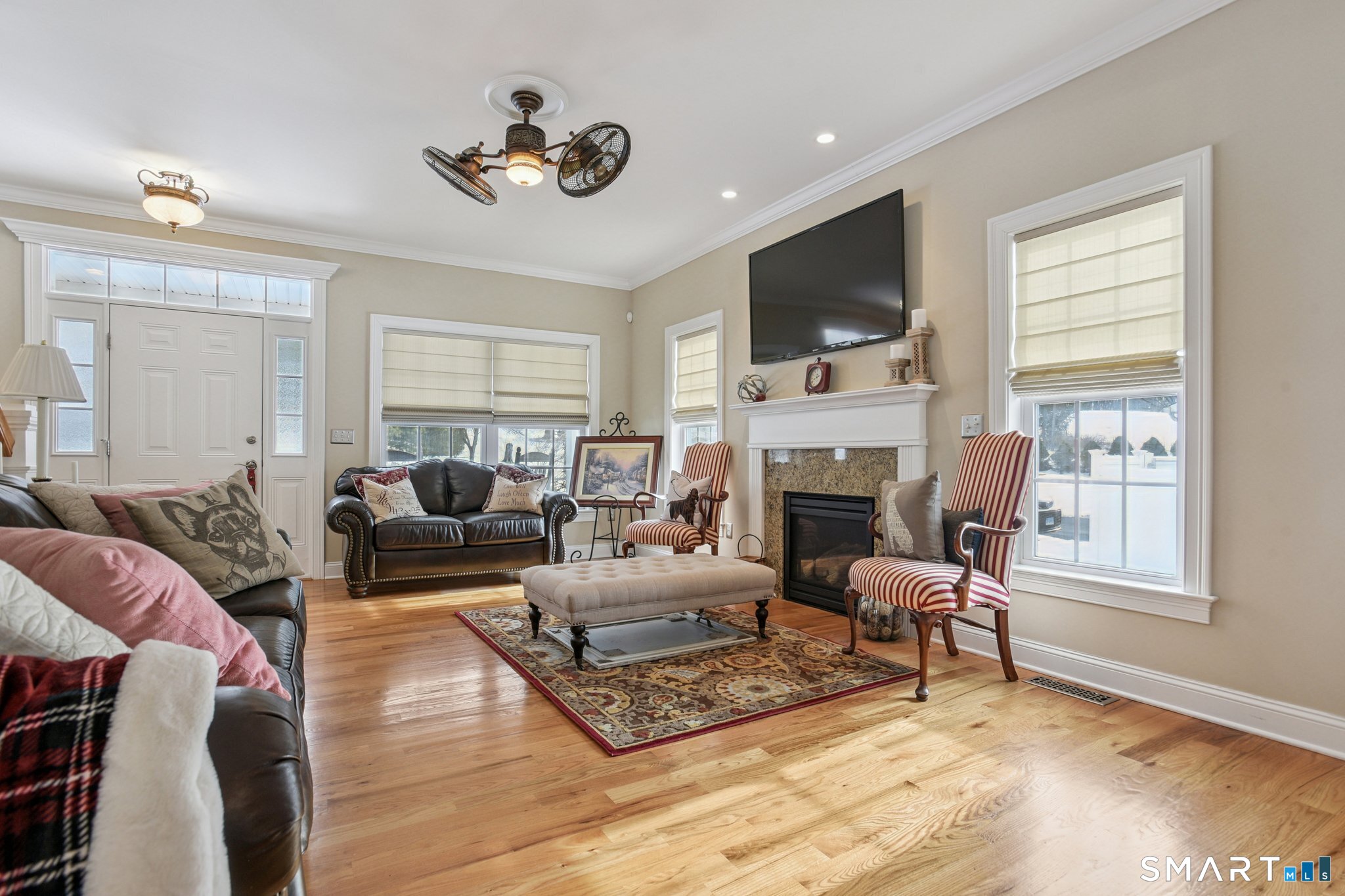 10 Ball Road North Haven, CT 06473 - Photo 5 of 35 a living room with furniture fireplace and a flat screen tv