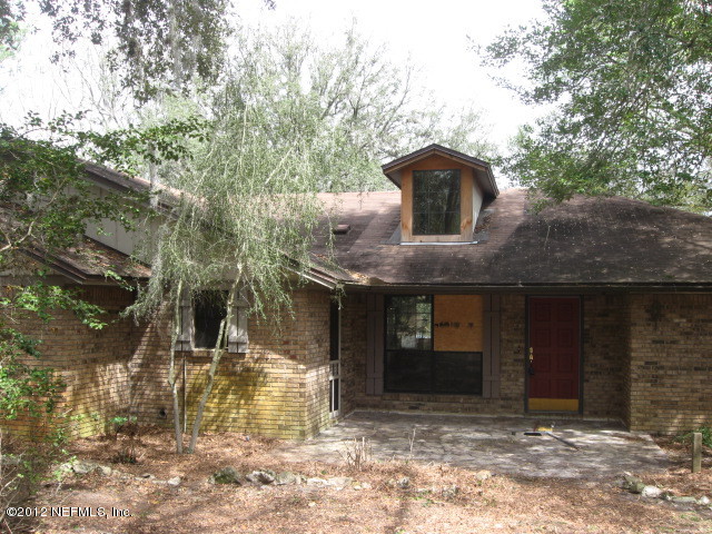 6258 Little Lake Geneva Road Keystone Heights, FL 32656 - Photo 1 of 1 a front view of a house with a yard