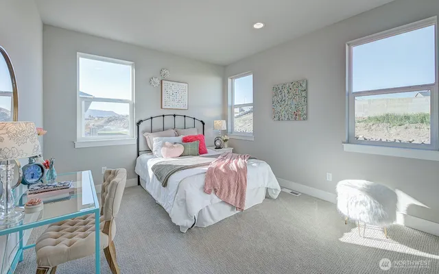 a bedroom with a bed and window