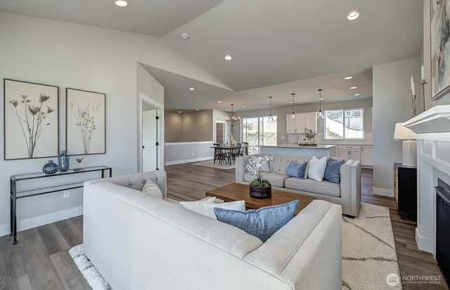 a living room with fireplace furniture and a fireplace