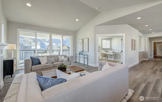 a living room with furniture and a large window