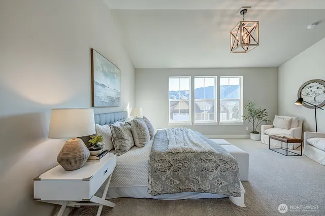 a spacious bedroom with a bed and window