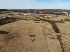 an aerial view of residential building and ocean
