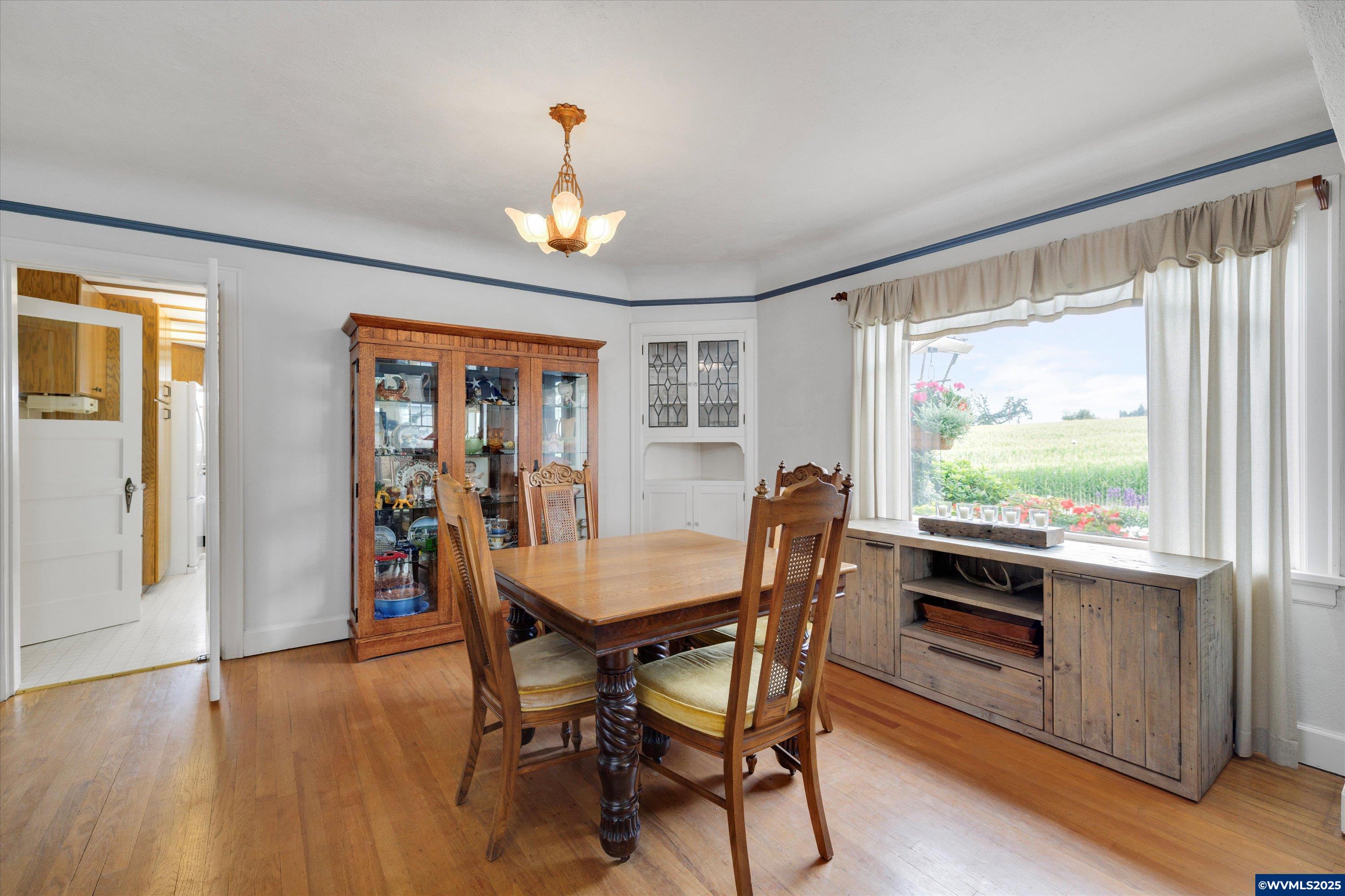 21303 South Central Point Road Canby, OR 97013 - Photo 39 of 50 a view of a dining room with furniture window and wooden floor