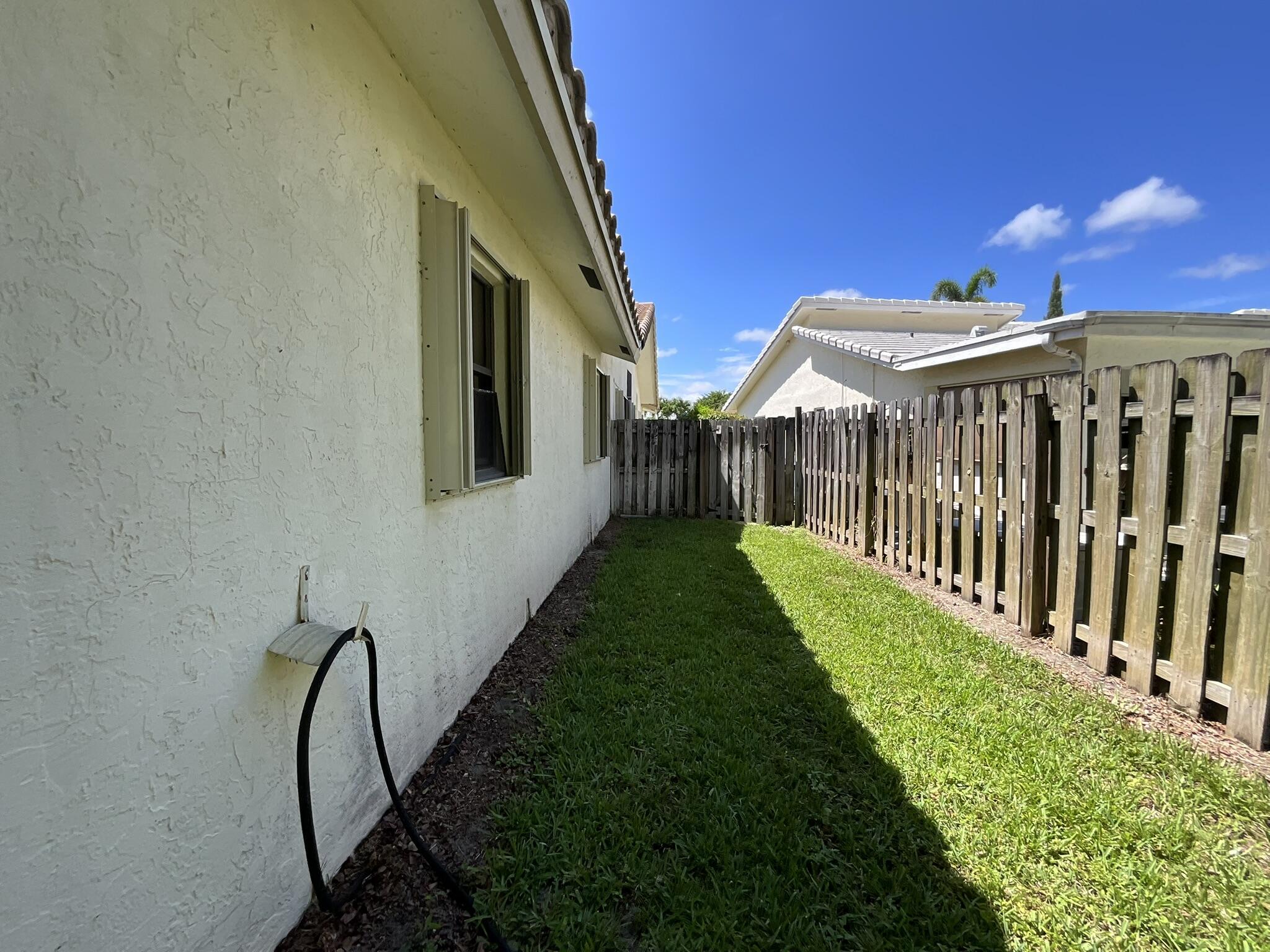 6114 Woodbury Road Boca Raton, FL 33433 - Photo 30 of 30 Side Yard