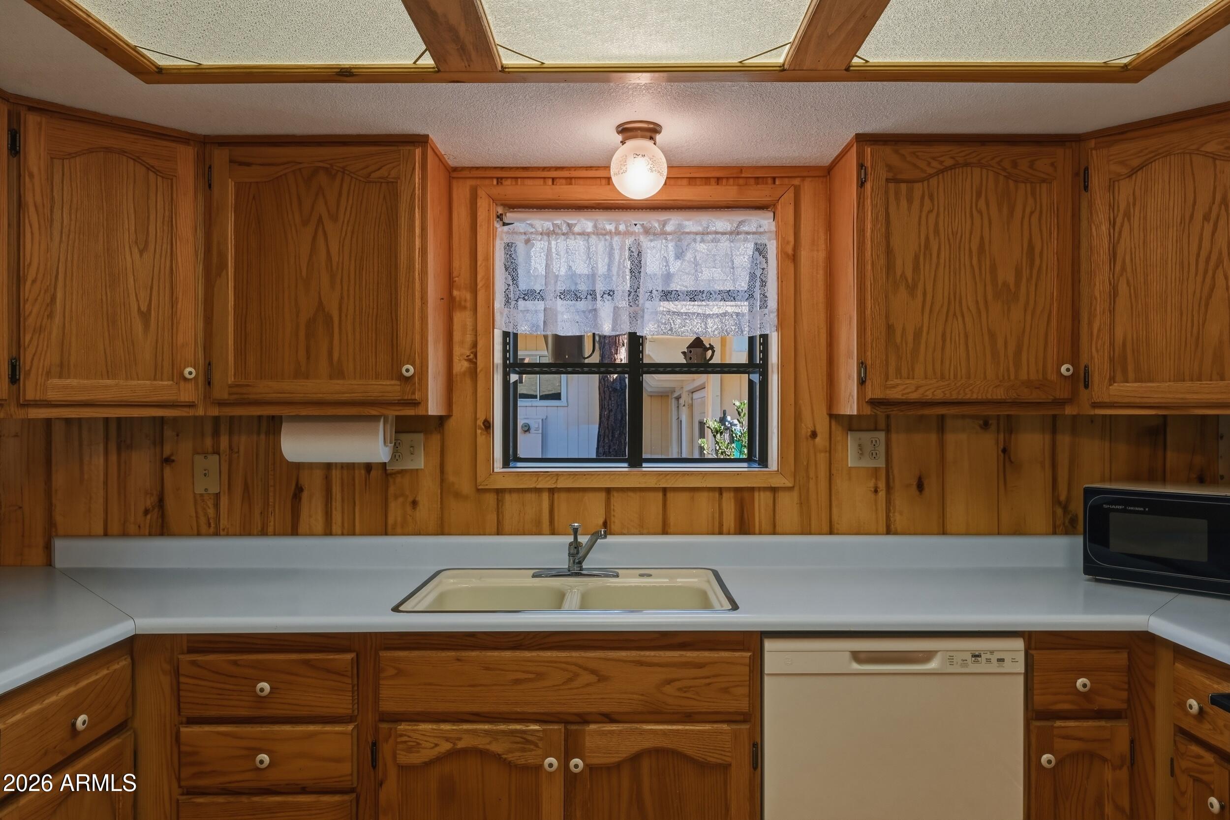 809 North Ponderosa Circle Payson, AZ 85541 - Photo 11 of 21 a kitchen with a sink cabinets and window