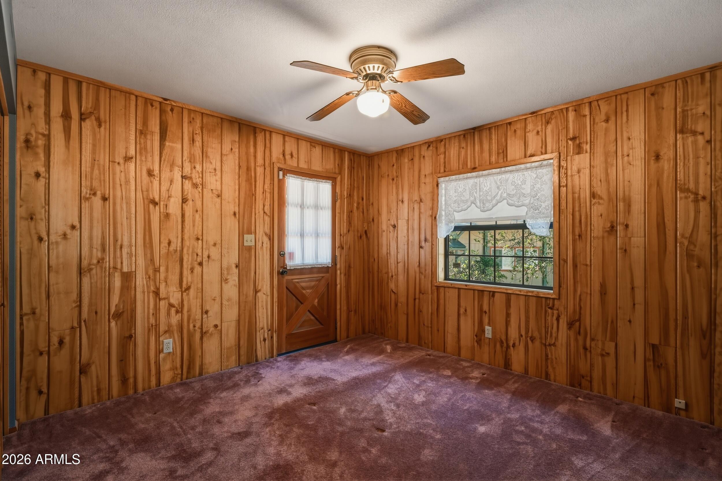 809 North Ponderosa Circle Payson, AZ 85541 - Photo 14 of 21 wooden floor in an empty room with a window