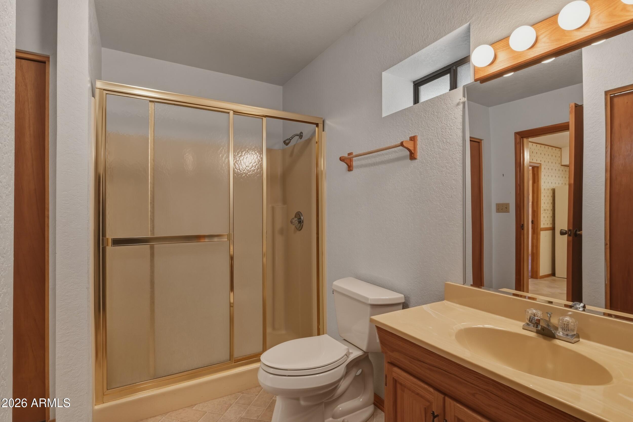 809 North Ponderosa Circle Payson, AZ 85541 - Photo 15 of 21 a bathroom with a sink a toilet and shower