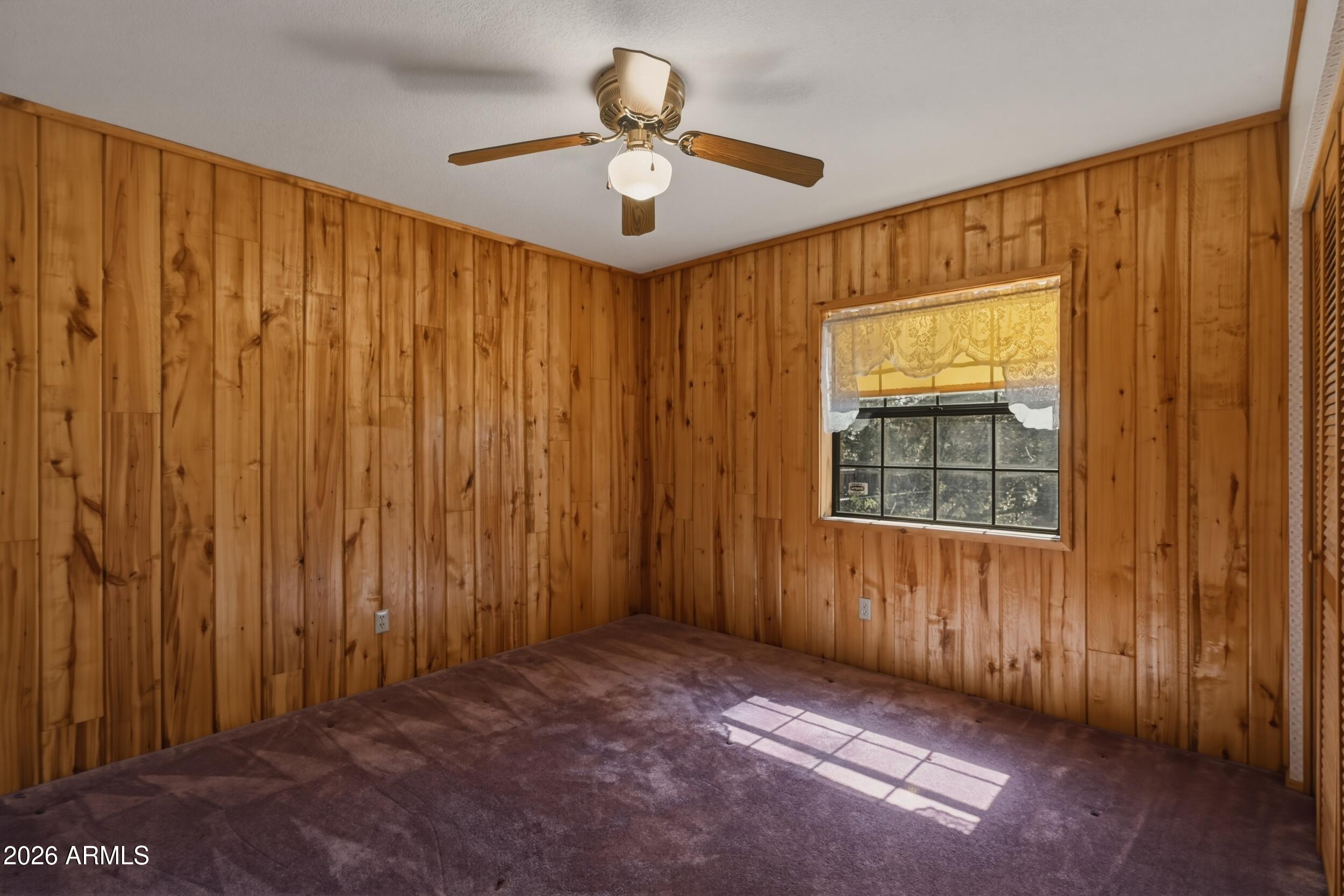 809 North Ponderosa Circle Payson, AZ 85541 - Photo 17 of 21 a view of a livingroom with a ceiling fan and a window