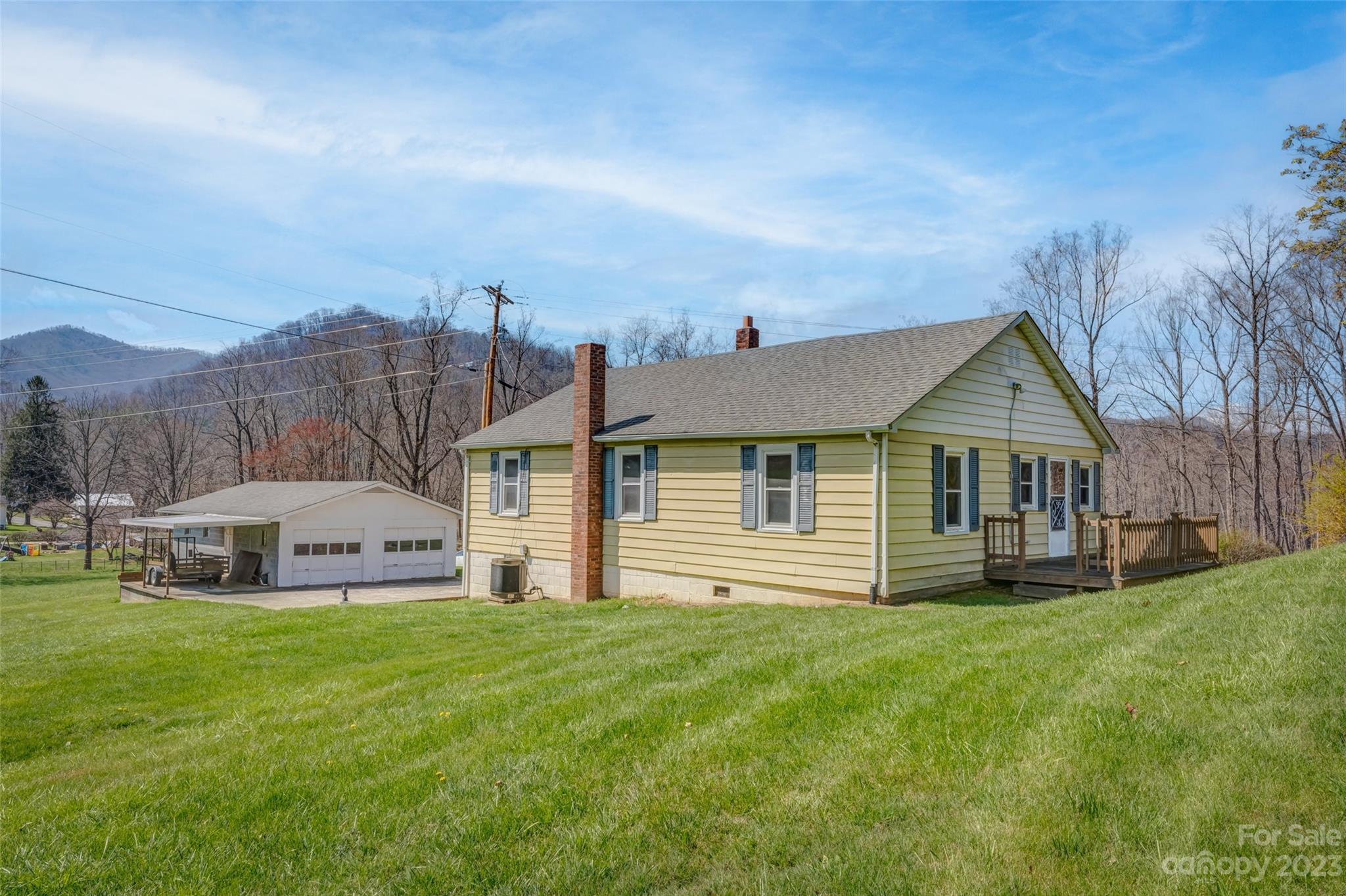 1345 Max Thompson Road Canton, NC 28716 - Photo 2 of 43 a front view of house with yard and green space