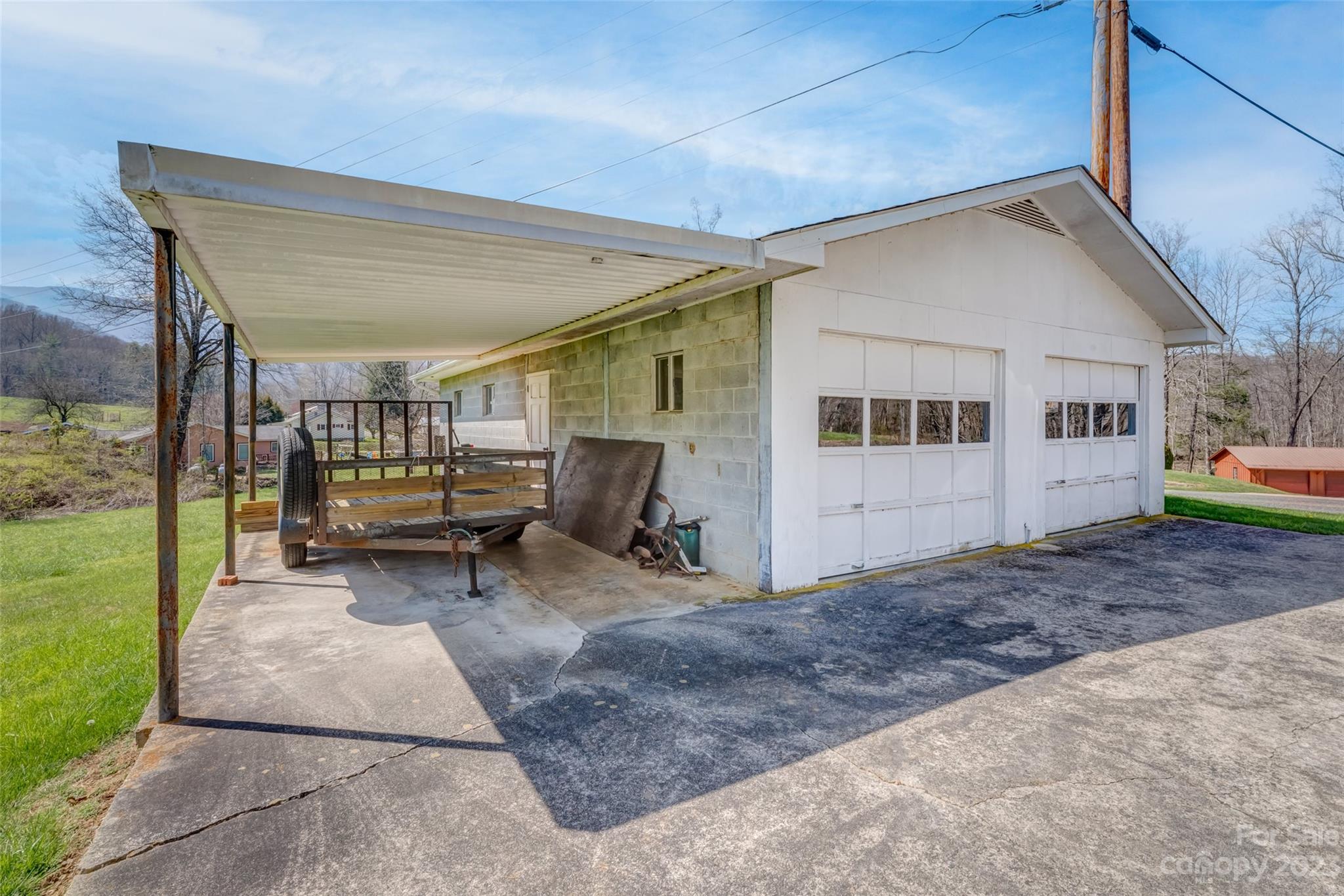 1345 Max Thompson Road Canton, NC 28716 - Photo 26 of 43 a view of backyard with a patio and a garden