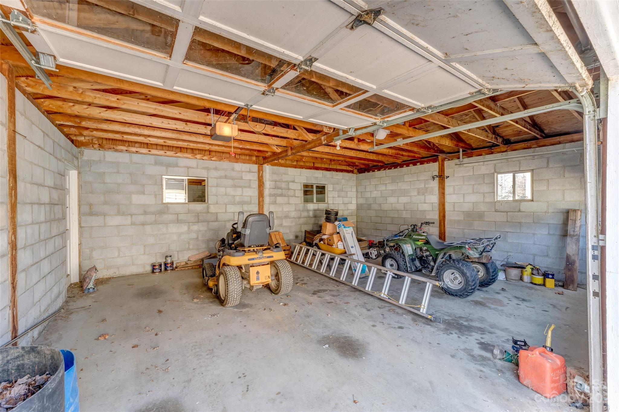 1345 Max Thompson Road Canton, NC 28716 - Photo 28 of 43 a view of patio with a table and chairs under an umbrella