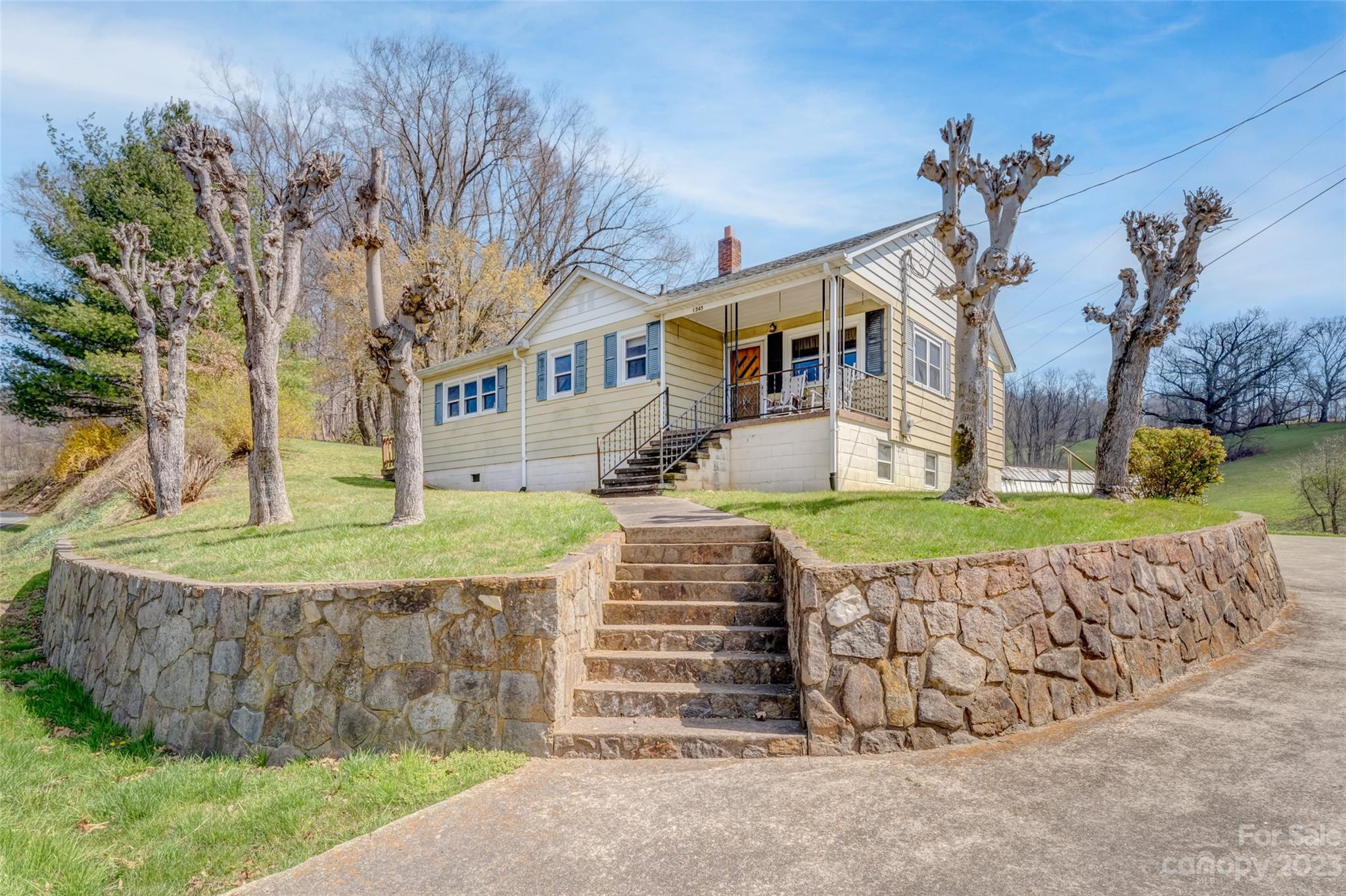 1345 Max Thompson Road Canton, NC 28716 - Photo 35 of 43 front view of a house with a yard