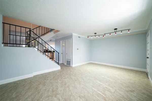 a view of a hallway with staircase