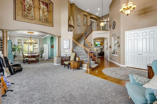 a view of a room with wooden floor and windows