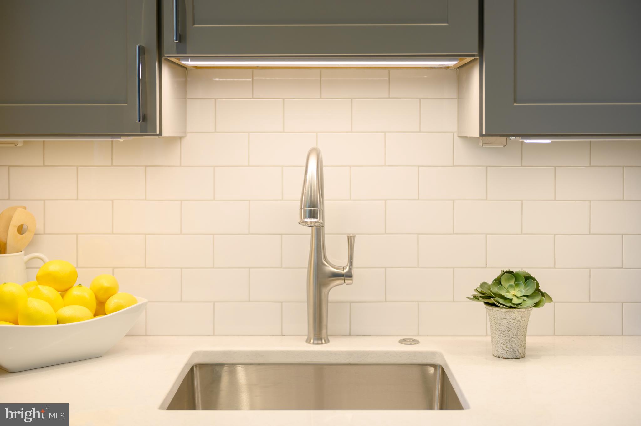 418 7th Street Southeast, Unit 303 Washington, DC 20003 - Photo 11 of 15 Custom backsplash & under-cabinet lighting