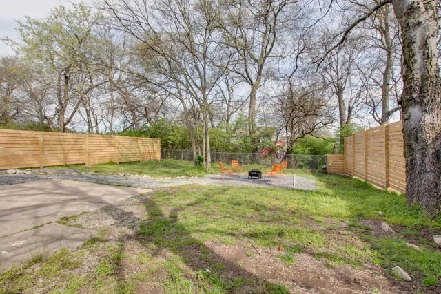 a view of backyard with swimming pool