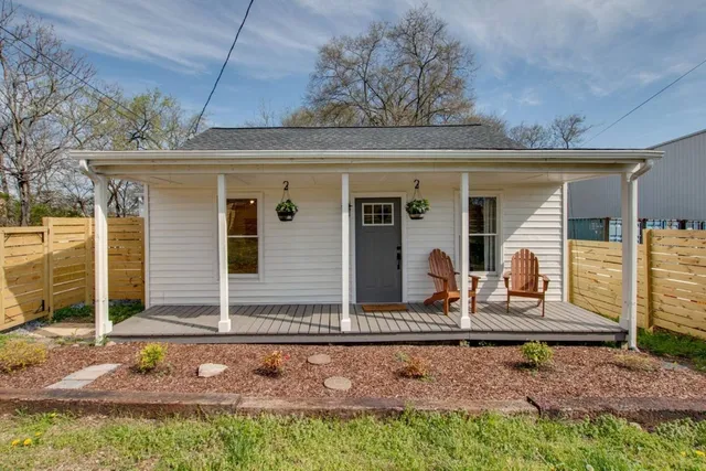 front view of a house with a bench