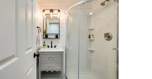 a bathroom with a sink and a mirror