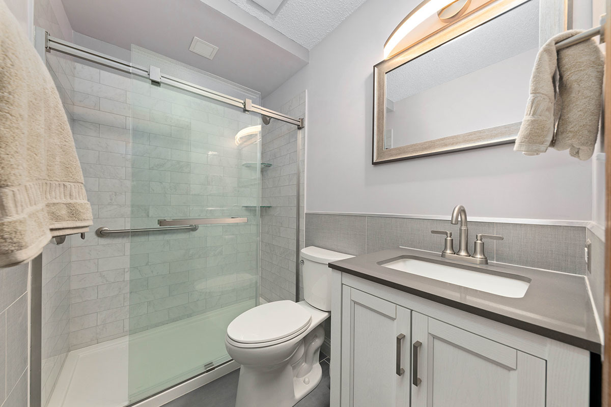 3342 Fox Hill Road Aurora, IL 60504 - Photo 18 of 25 a bathroom with a sink a toilet and shower