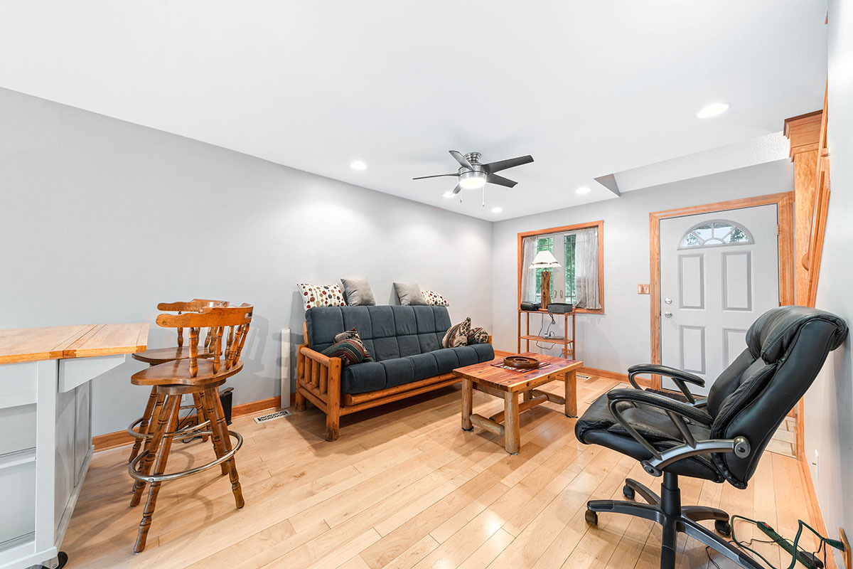 3342 Fox Hill Road Aurora, IL 60504 - Photo 9 of 25 a living room with furniture a rug and a window