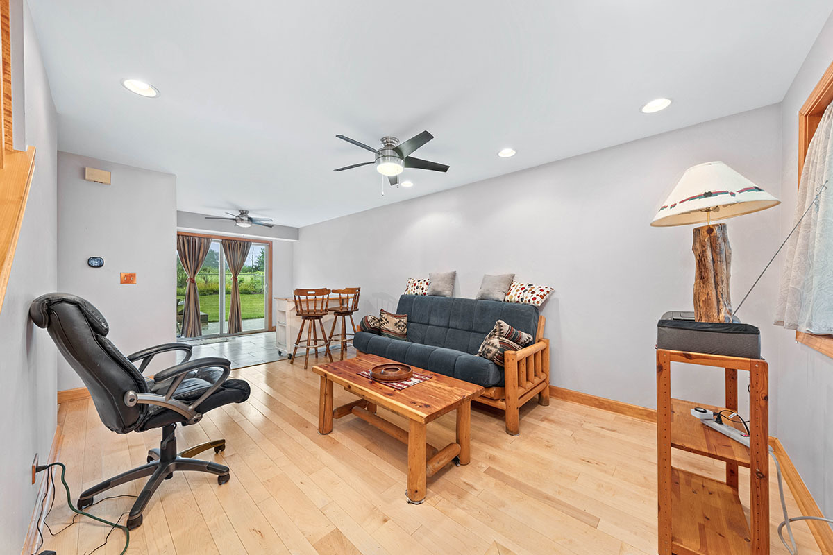 3342 Fox Hill Road Aurora, IL 60504 - Photo 10 of 25 a living room with furniture a chandelier and a window
