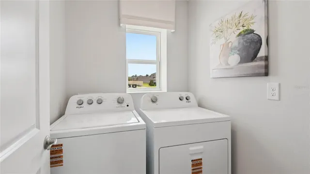 a utility room with dryer and washer